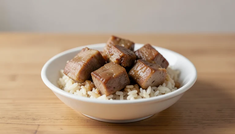 AI illustration of Illustration of cooked braised pork pieces over rice.