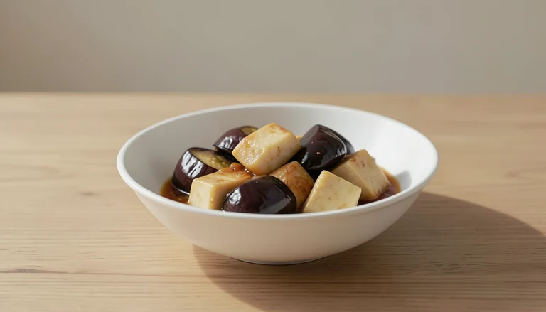 AI illustration of Generic editorial illustration of cooked eggplant and tofu.