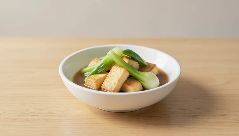 AI illustration of golden tofu pieces with cooked bok choy